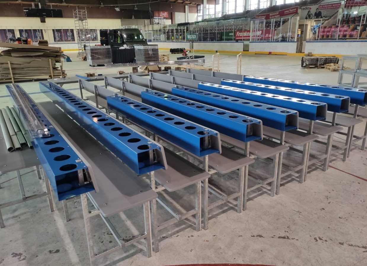Aluminum water-bottle racks for player bench