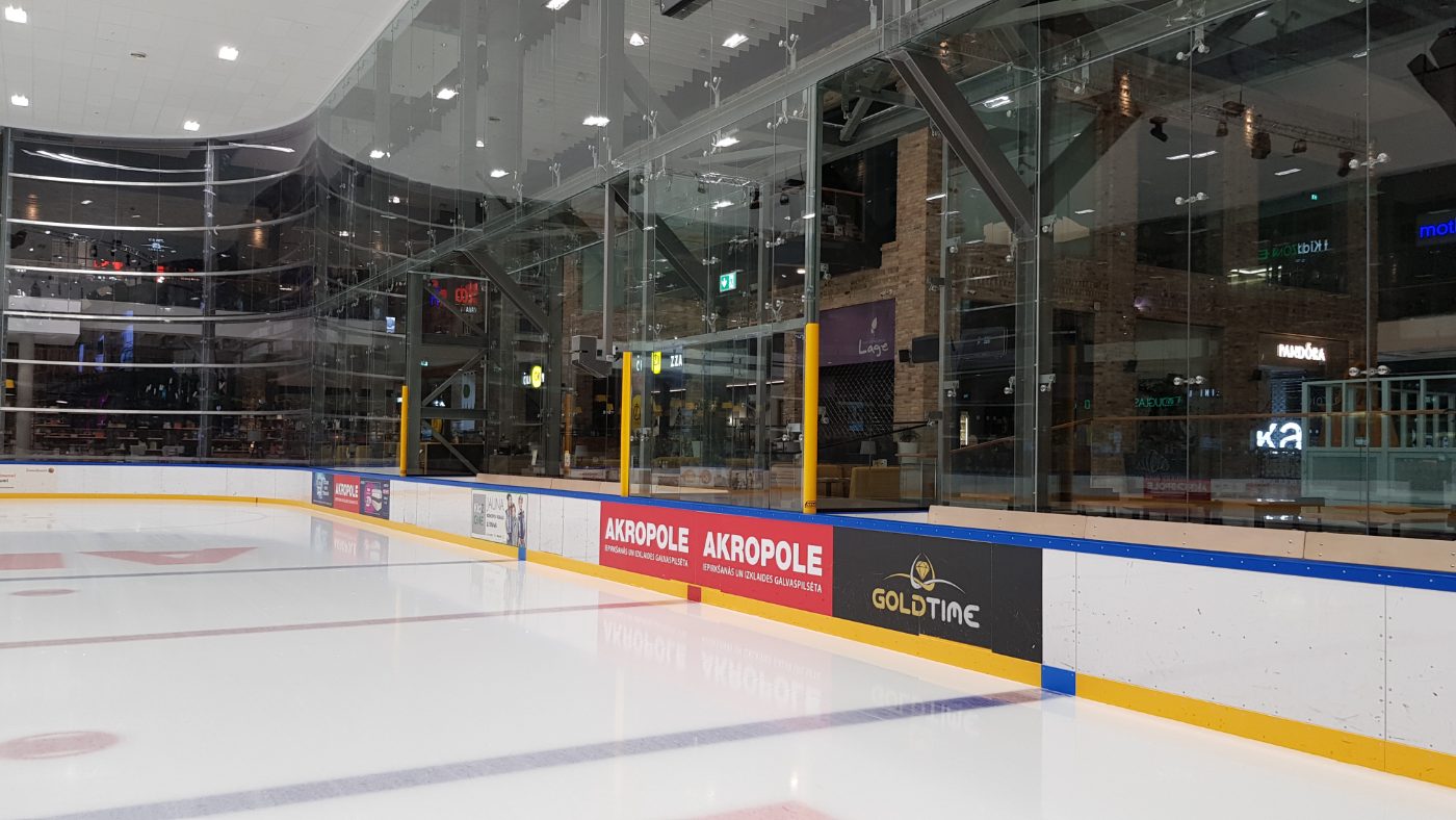 Custom dasherboards with branded advertising panels at indoor rink