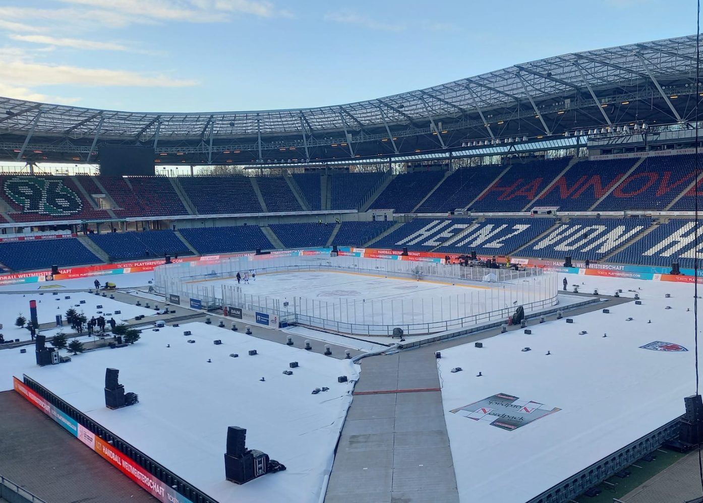 Aerial view of outdoor rink with hockey area and public skating