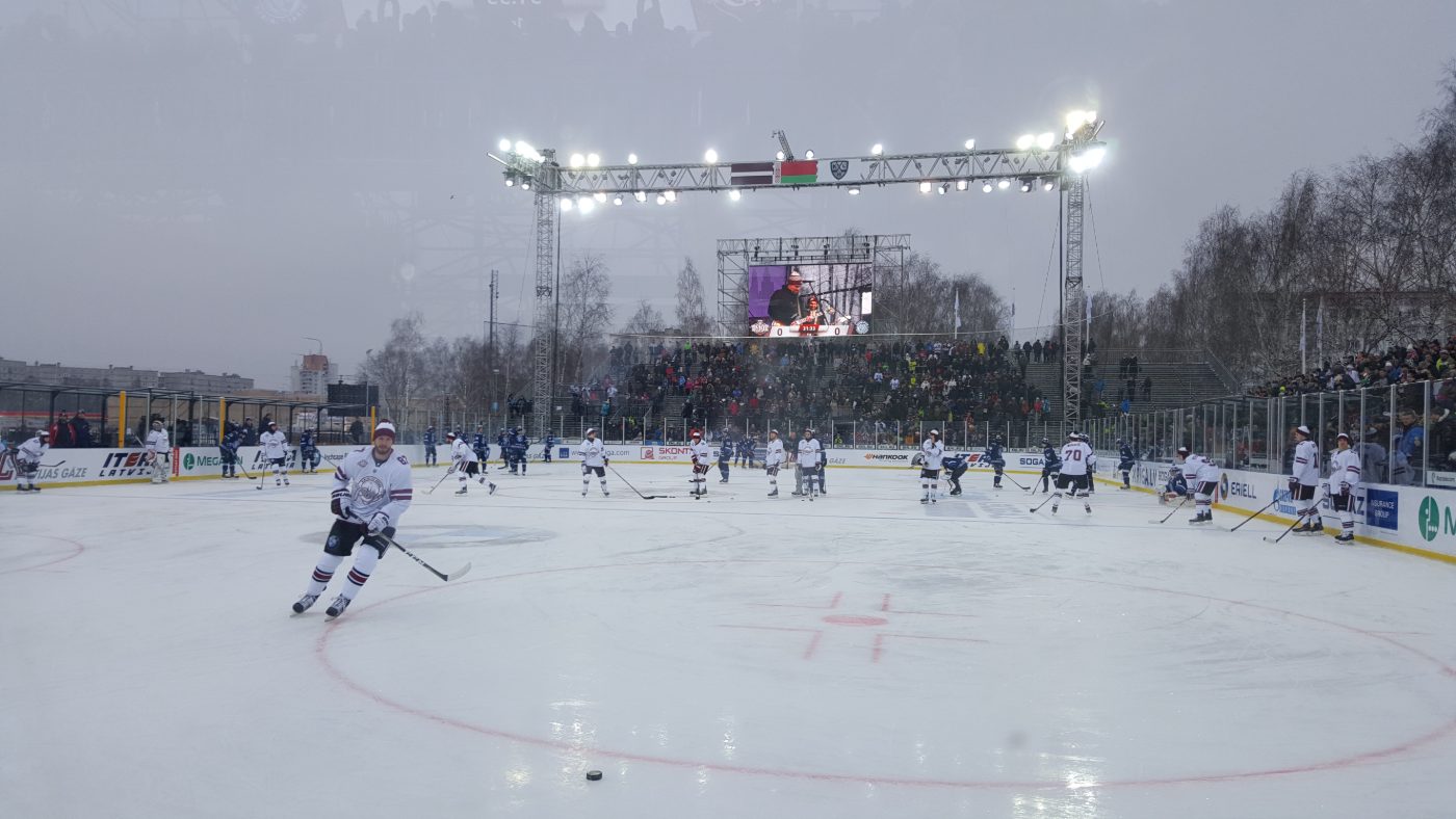 Outdoor rink installation with glass panels in snow