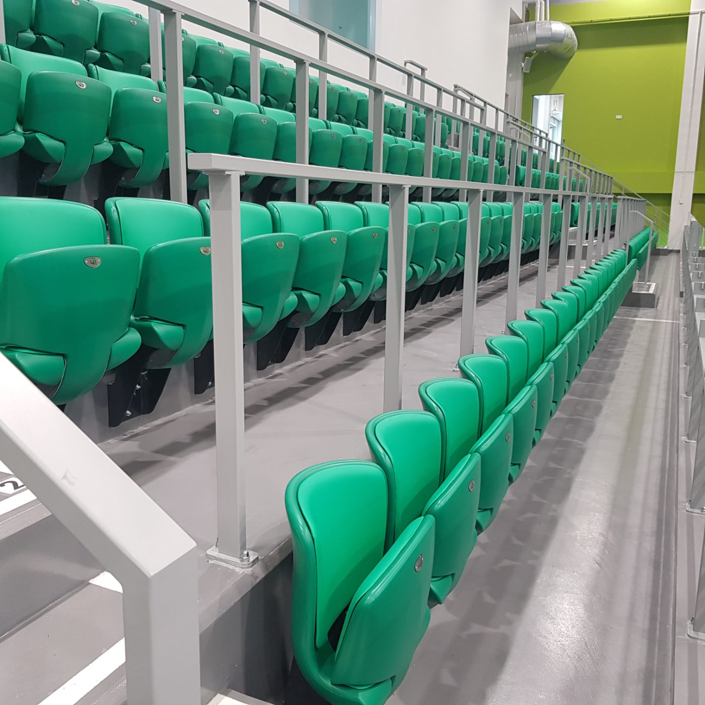 Green telescopic grandstand with court view