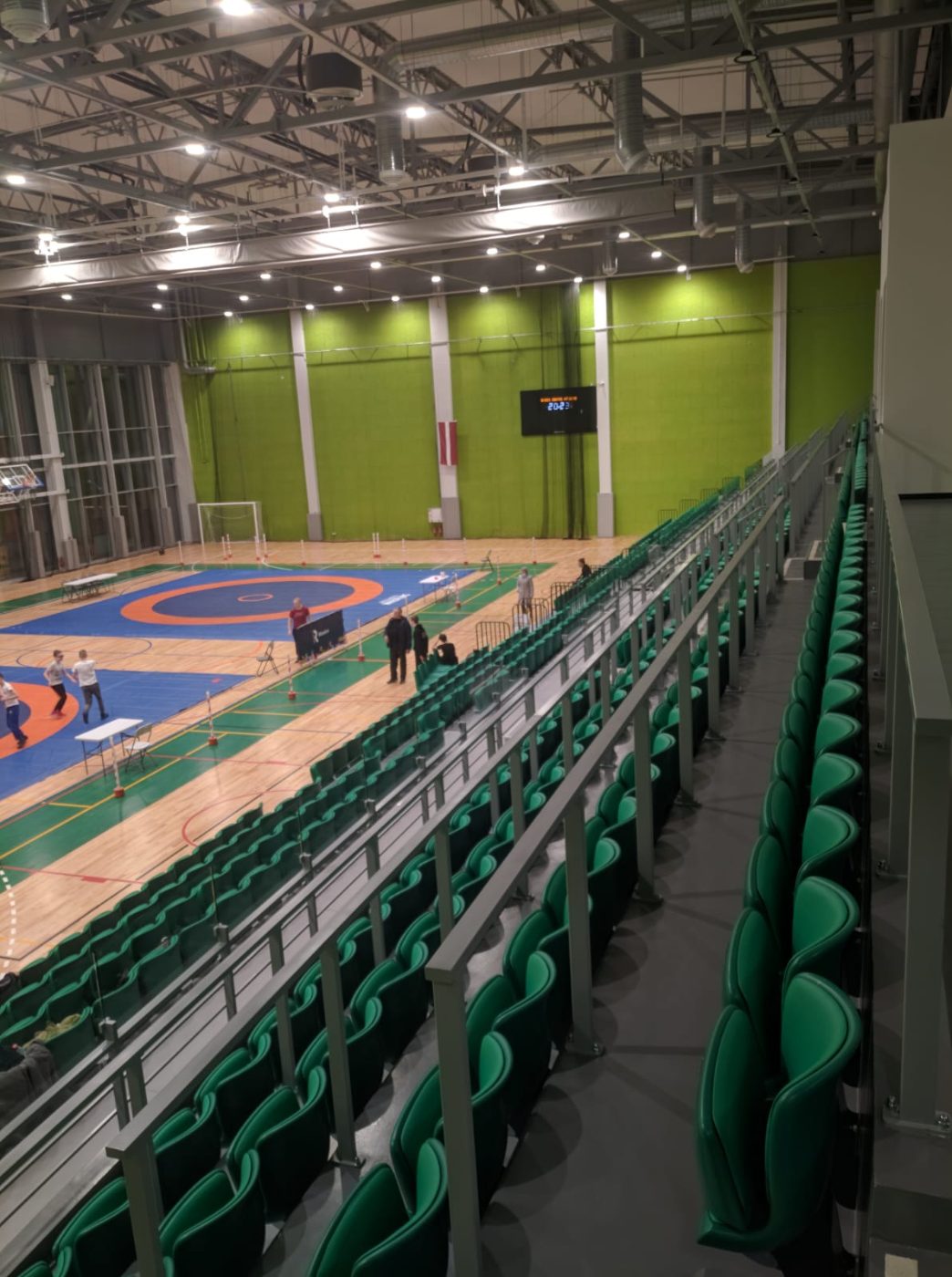 Orange indoor arena seating with railings