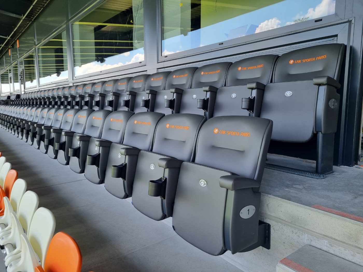 VIP outdoor seats with armrests and cup holders